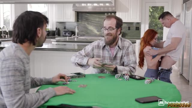 While her husband plays cards, a red-haired milf goes all out with his friends in a hard gangbang.